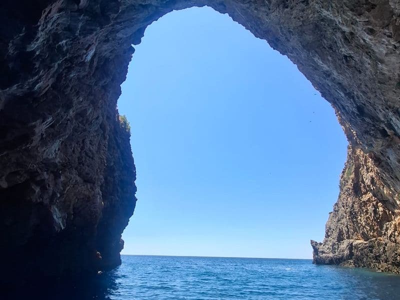 Natural sea cave arch on the Montenegrin coast seen from the boat