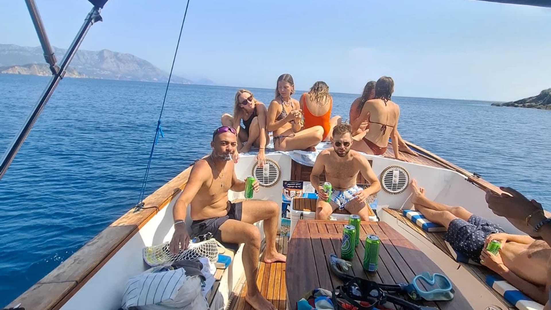 Guests on deck with snorkelling gear and drinks