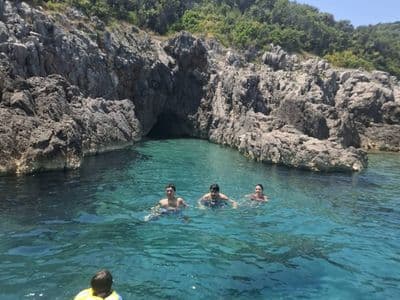 Swimming stop next to a sea cave