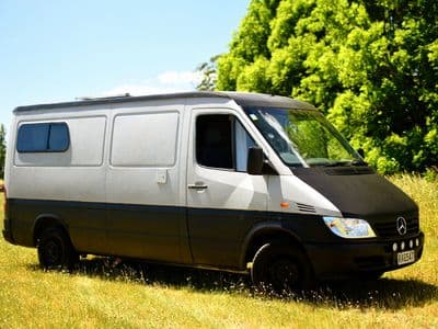 Unbranded Mercedes-Benz Sprinter campervan The A Van parked on grass