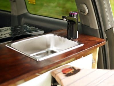 Sink with electric water tap in Toyota Voxy sleepervan