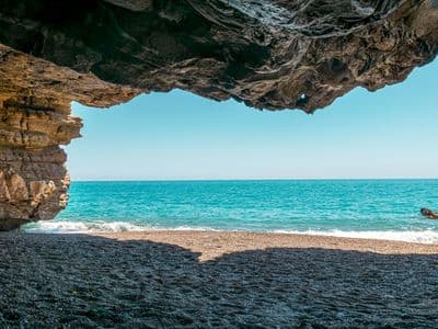 Beach view from inside a sea cave