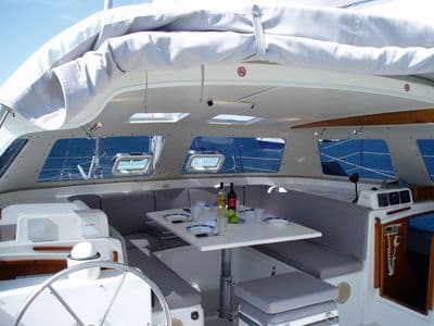 Dreamcatcher's combined open saloon and cockpit with dining table