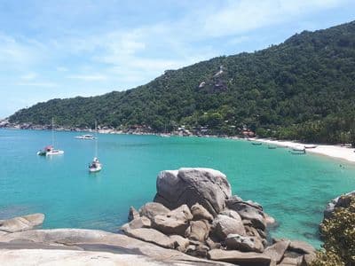 Turquoise bay with boulders and white beach on Koh Phangan