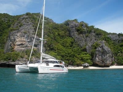 Catamaran Dreamcatcher anchored in a bay of Ang Thong Marine Park
