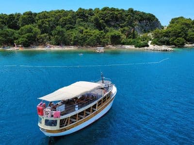 Matek boat anchored in a cove, drone shot