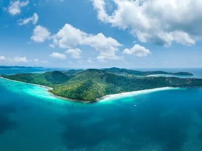 Aerial view of an island with white beach