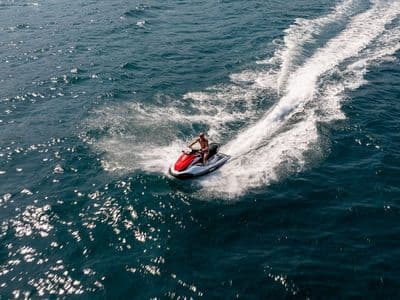 Jet ski riding near the yacht