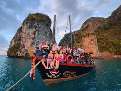 Traditional 100-year-old Siamese junk boat on turquoise water near Krabi