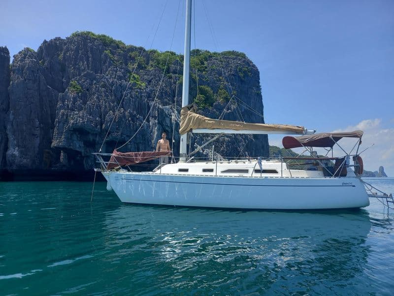 Sailing yacht Sanora at anchor near limestone islands, Koh Samui
