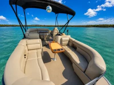 Comfortable curved seating on The Prosperity pontoon boat