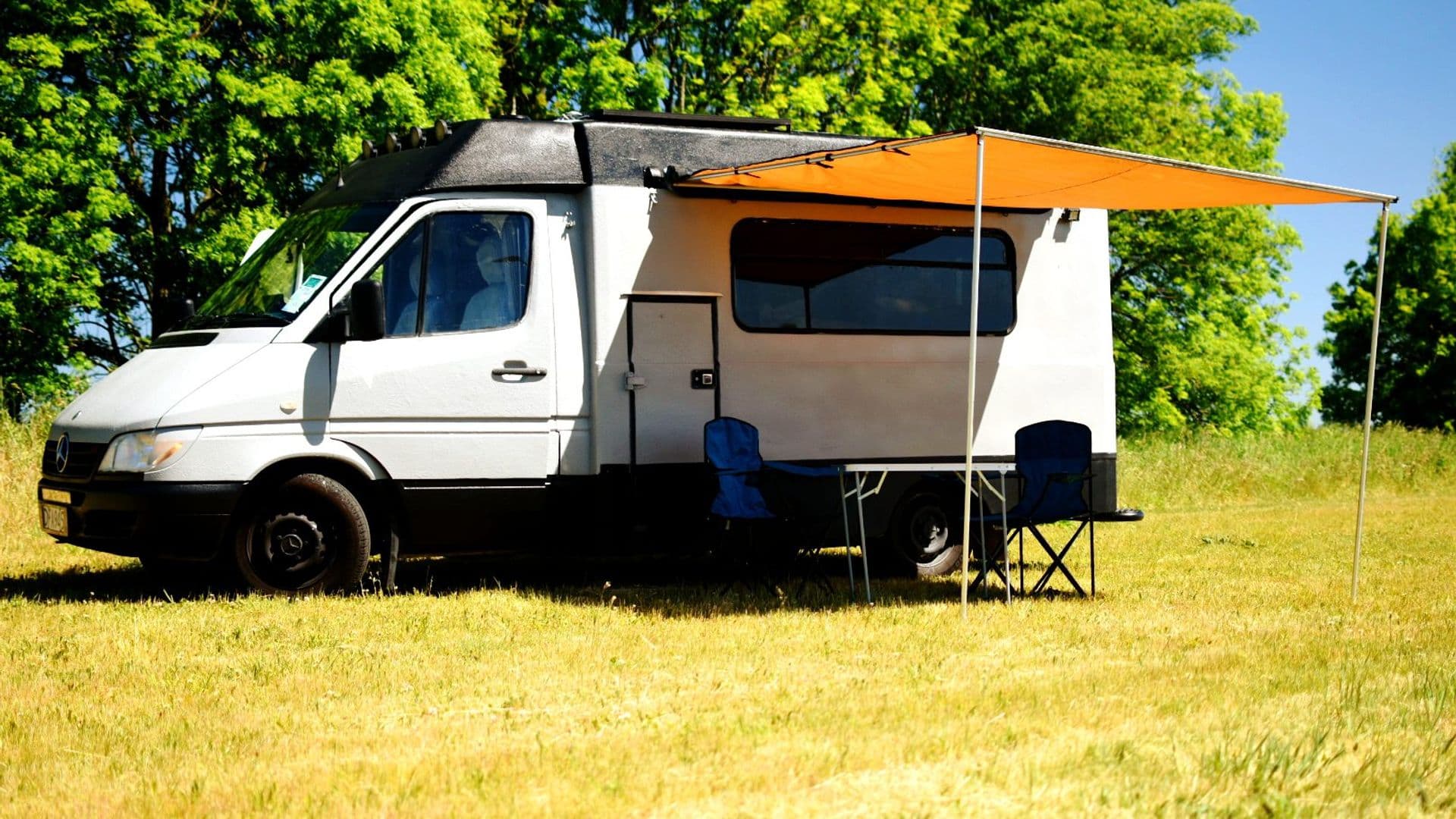 Unbranded Mercedes-Benz Sprinter campervan GI Joe with awning, camping table and chairs